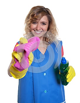 Laughing housewife with blond hair and damp cloth