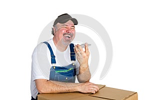 Laughing jovial worker using a speaker phone