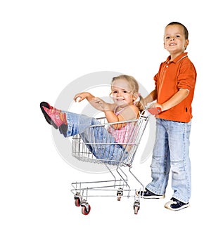 Laughing kids with shopping cart