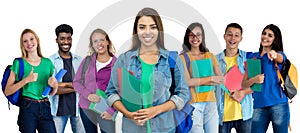 Laughing latin american female student with group of multi ethnic young adults