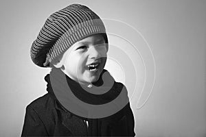 Laughing Little Boy in Cap. photo