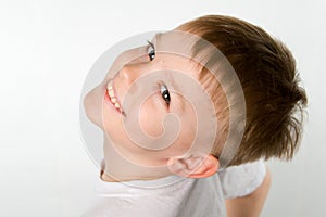 Laughing little boy in t-shirt under the original foreshortening angel photo