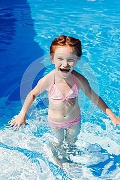 laughing little child in bikini photo