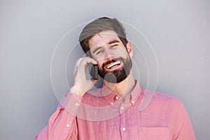 Laughing man having conversation on mobile phone