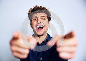 Laughing man pointing at you