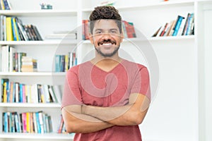 Laughing mature adult mexican man with beard
