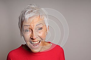 Laughing mature woman in her sixties