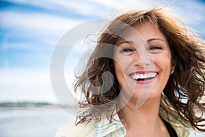 Laughing middle aged woman