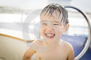 Laughing Mixed Race Boy Having Fun at the Water Park