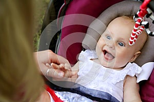 Laughing Newborn Baby Girl in Car Seat