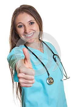 Laughing nurse showing thumb up