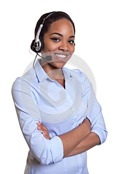 Laughing phone operator with headset and crossed arms