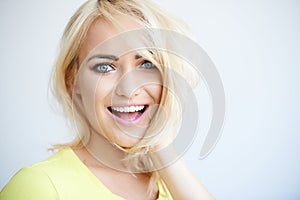 Laughing pretty young blond woman