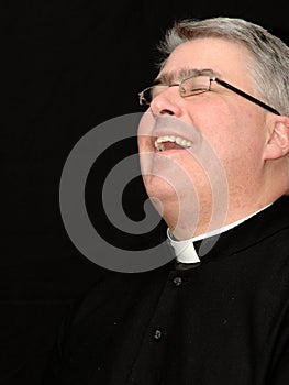Laughing priest