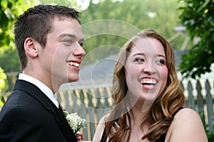 Laughing Prom Couple Showing Boutonniere