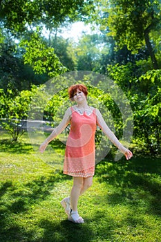 Laughing red haired girl on a sunny day having fun