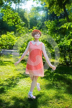 Laughing red haired girl on a sunny day having fun