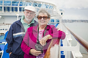 Laughing Senior Couple Enjoying The Deck of a Cruise Ship