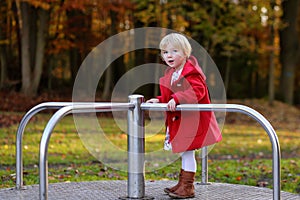 Laughing small girl playing in the park