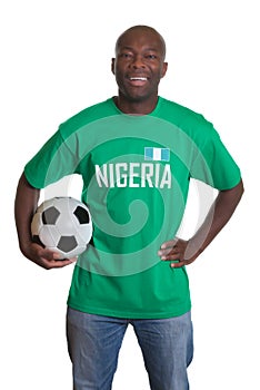 Laughing soccer fan from Nigeria with ball