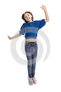 Laughing teen girl in a jump. Isolated on white background