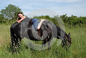 Laughing teen and horse