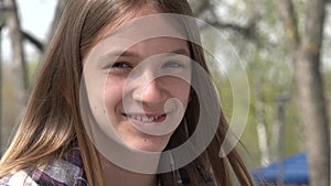 Laughing Teenager Kid Playing at Playground in Park, Adolescent Child Smiling, Happy Young Girl Portrait Laughs, Children Outdoor