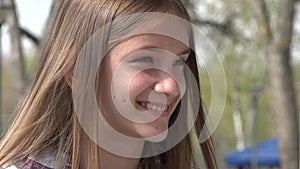 Laughing Teenager Kid Playing at Playground in Park, Adolescent Child Smiling, Happy Young Girl Portrait Laughs, Children Outdoor