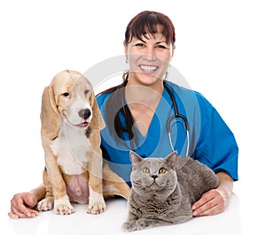 Laughing veterinarian hugging cat and dog. isolated