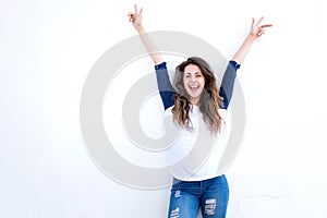 Laughing woman arms raised