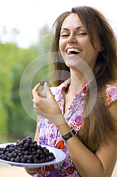 Laughing woman with blackberry