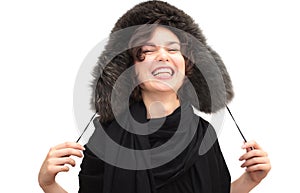 Laughing woman in fur ear-flapped hat photo