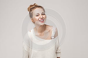 Laughing woman looking at camera and toothy smile.