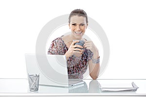 Laughing woman at office desk