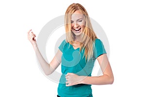 Laughing woman singing and dancing