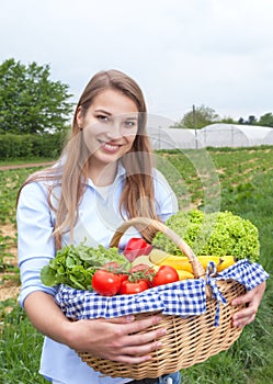 Laughing woman with vegetables fresh from the farm