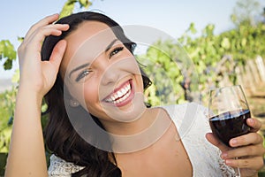 Laughing Young Adult Woman Enjoying A Glass of Wine in Vineyard