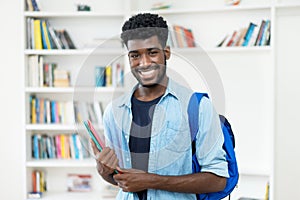 Laughing young african american male student with beard