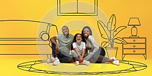 Laughing young black parents hug girl, sit on floor, enjoy own home, isolated on yellow studio background