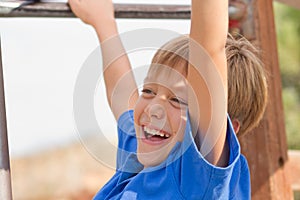 Laughing young boy on the playground