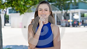 Laughing young caucasian woman with brunette hair