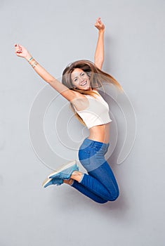 Laughing young girl jumping