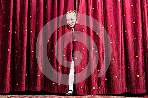 Laughing young girl making her entry on stage