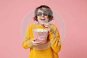 Laughing young woman girl in 3d imax glasses posing isolated on pink background. People sincere emotions in cinema photo
