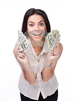 Laughing young woman holding money