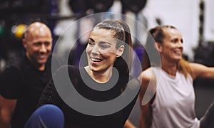 Laughing young woman relaxing after a gym class