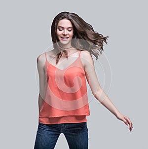 Laughing young woman running, having fun and enjoying life, beautiful joyful girl looking up full length portrait