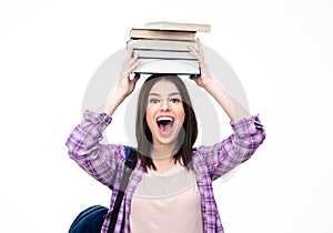 Laughing young wowan with books on head photo