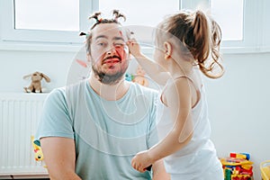 Laughter and Lipstick A Funny Father-Daughter Moment Captured Forever