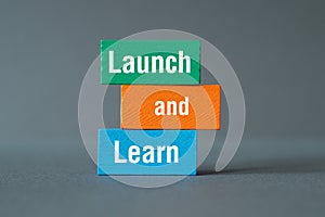 Launch and Learn - word concept on building blocks, text